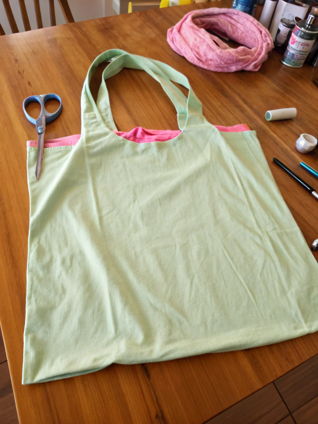 DIY No Sew T-Shirt Bag: How to Make 1 in 5 Easy Steps! 1 Colorful collection of DIY no sew t-shirt bags made from various t-shirts.