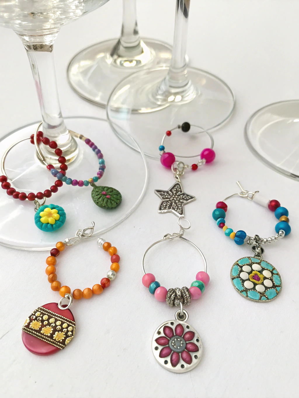DIY Wine Glass Charms Recycled: 7 Easy How-To Ideas 1 A collection of colorful DIY wine glass charms made from recycled materials, displayed on wine glasses.