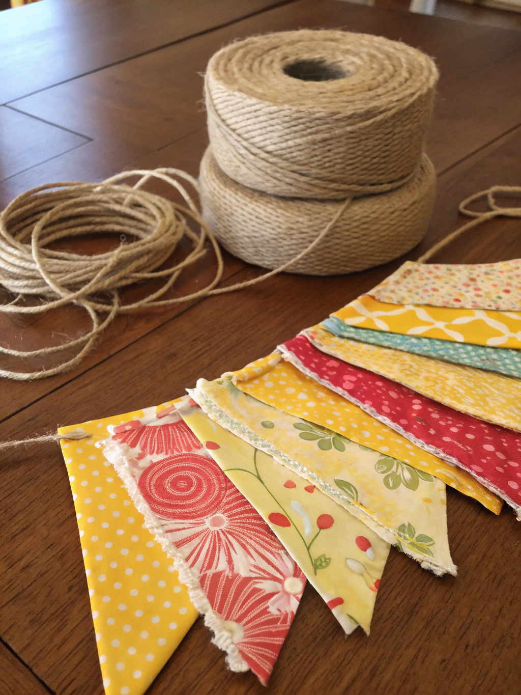 How to Make a DIY Fabric Scrap Summer Garland in 5 easy Steps 1 Materials for DIY fabric scrap summer garland including fabric scraps, twine, and scissors.