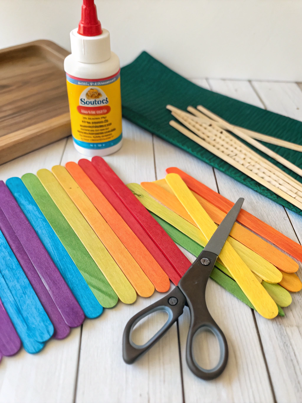 DIY Popsicle Stick Summer Crafts: 7 Easy Projects you need to do ! 2 A flat lay of materials needed for DIY popsicle stick summer crafts, including popsicle sticks, glue, paint, and scissors.