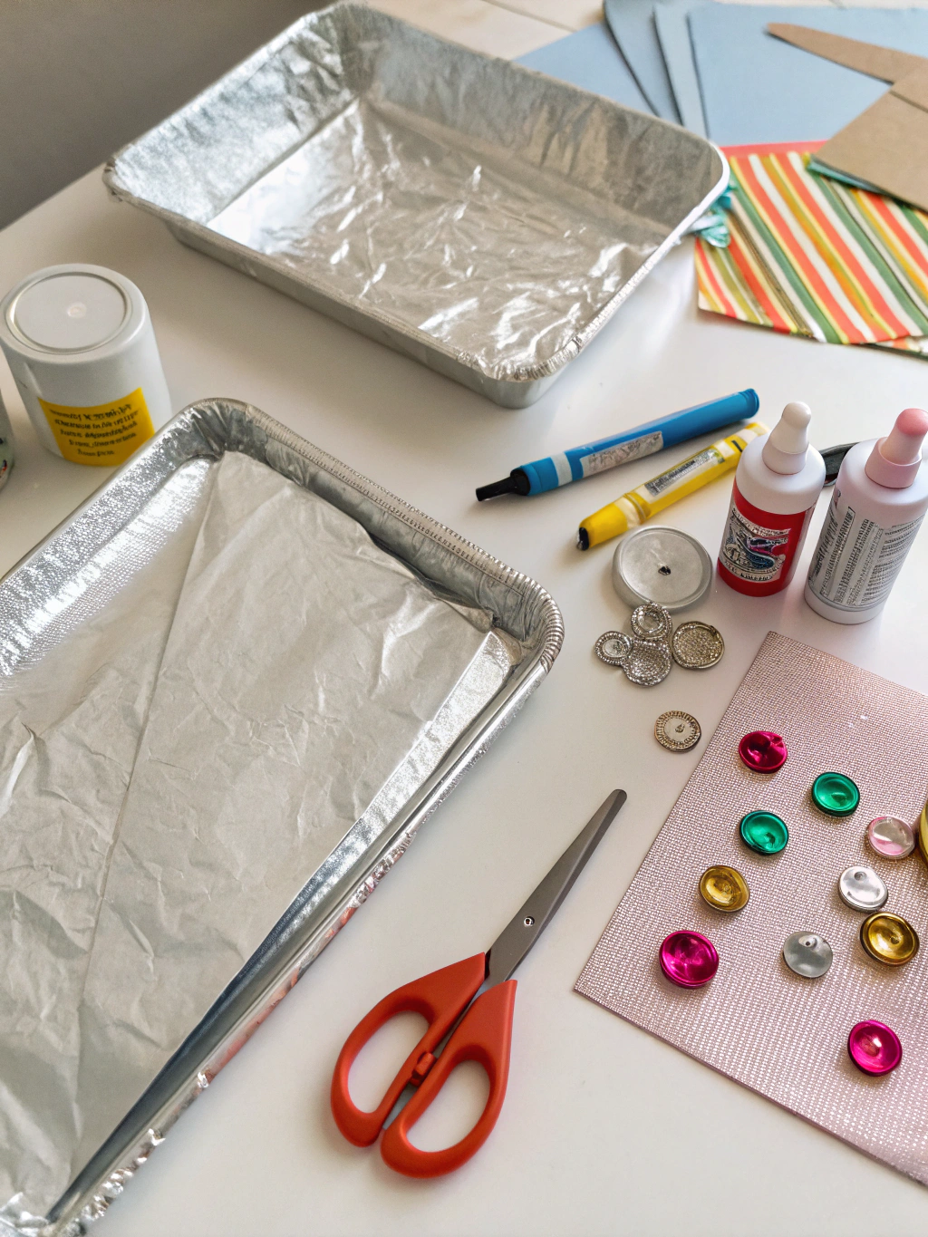 A collection of materials needed to upcycle tin foil, including scissors, glue, and clean used foil.